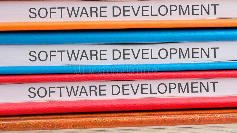 The concept of technology and development. Phrase, words, text SOFTWARE DEVELOPMENT close-up on the ends of the stock photo