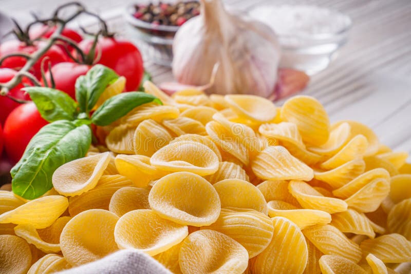 Concept of Traditional Italian Pasta with Tomatoes and Basil Stock