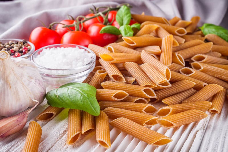 Concept of Traditional Italian Pasta with Tomatoes and Basil Stock