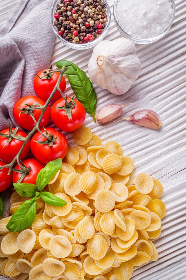 Concept of Traditional Italian Pasta with Tomatoes and Basil Stock