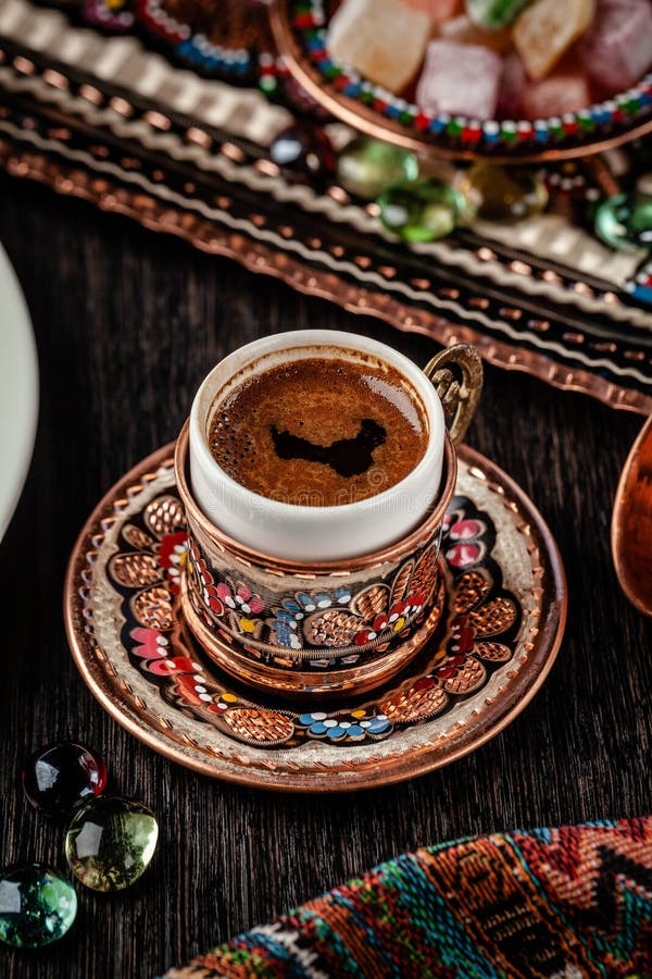 The concept of Turkish cuisine. Turkish brewed black coffee. Beautiful coffee serving in the restaurant. Background image royalty free stock photos The concept of Turkish cuisine. Turkish brewed black coffee. Beautiful coffee serving in the restaurant. Background image royalty free stock photos