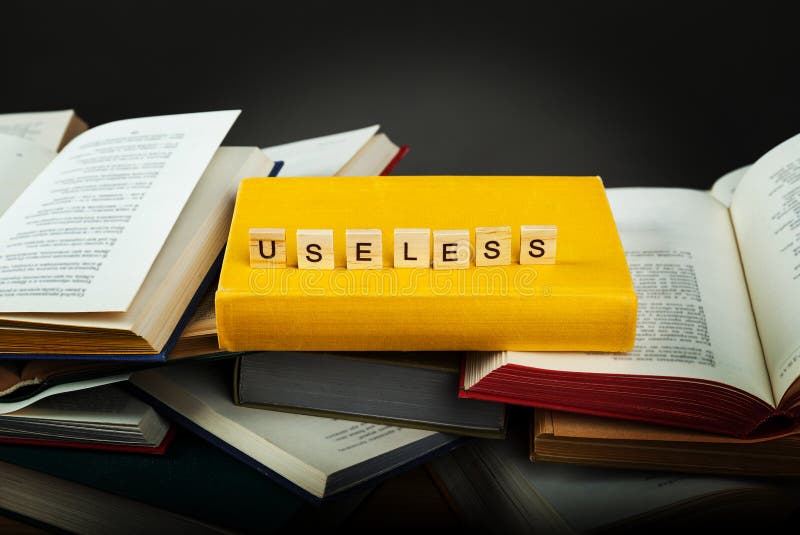 The Concept of Useless Knowledge. Useless  Word from Wooden Blocks