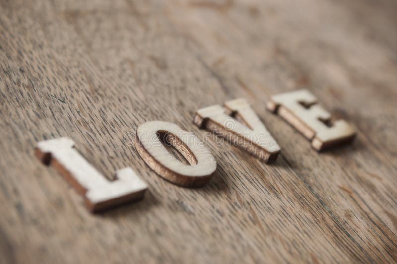 Concept wooden word on wooden table - Love