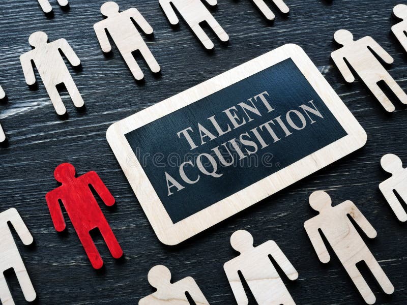 Talent acquisition concept. Small plaque and wooden figures. Talent acquisition concept. Small plaque and wooden figures.