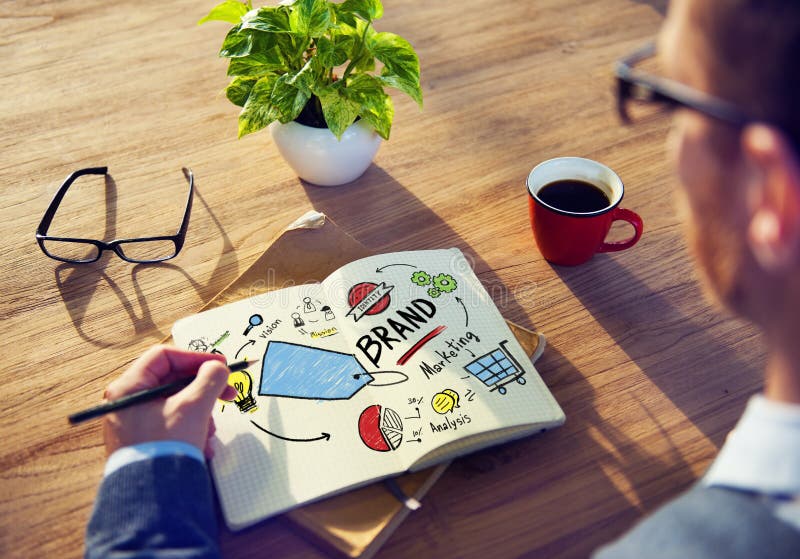 Concepto de la marca de Writing Planning Marketing del hombre de negocios foto de archivo libre de regalías Concepto de la marca de Writing Planning Marketing del hombre de negocios foto de archivo libre de regalías