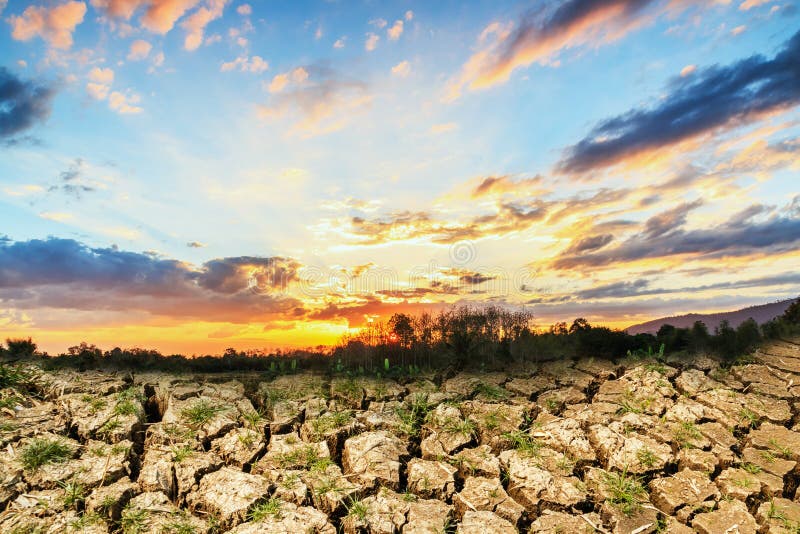 Concepts with sunset and cracks soil stock photo