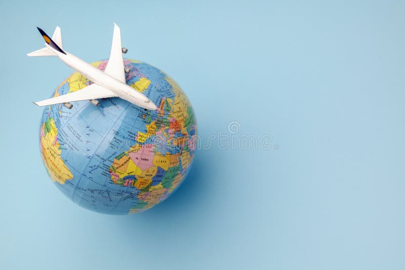 Conceptual airplane on Earth globe