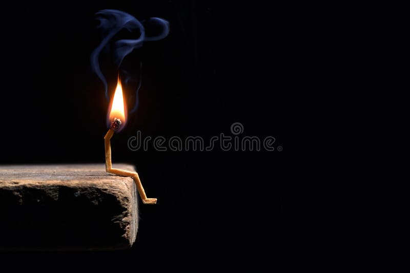 Conceptual burned out wooden matches on black background