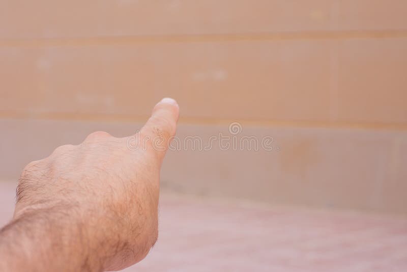 Conceptual hand pointing forward looking ahead. Business concepts looking forward and discovering new ground royalty free stock image.