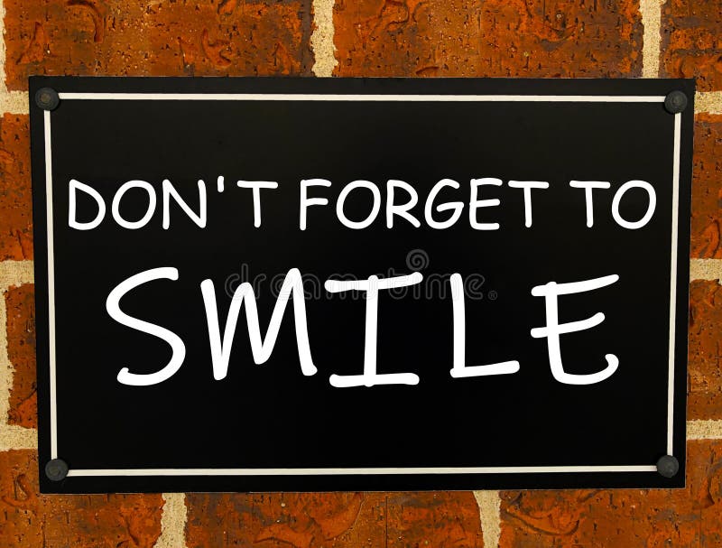 Conceptual hand writing showing Don T Forget To Smile. Business photo text Be always cheerful smiley spread and show. stock photo