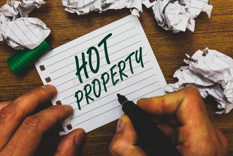 Conceptual hand writing showing Hot Property. Business photo text Something which is sought after or is Heavily Demanded Man holdi stock image Conceptual hand writing showing Hot Property. Business photo text Something which is sought after or is Heavily Demanded Man holdi stock image