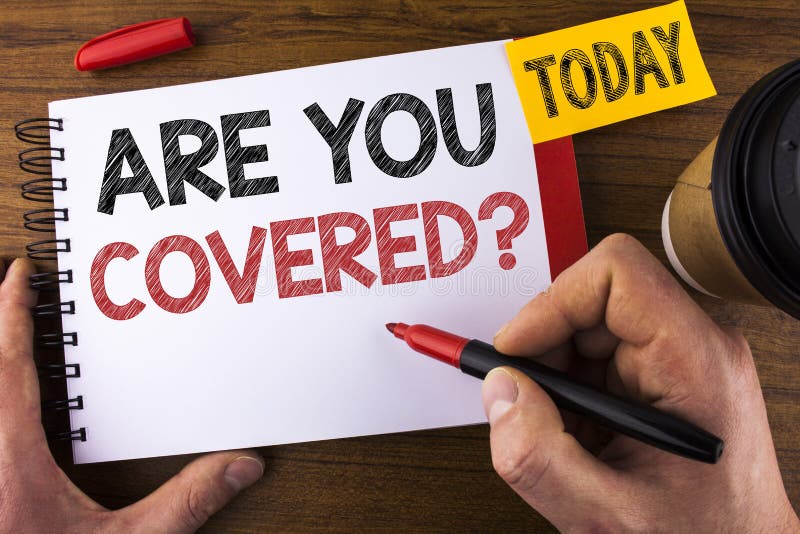 Conceptual hand writing showing Are You Covered Question. Business photo text Health insurance coverage disaster recovery written by Man Notepad holding Pen Wooden background Today Cup
