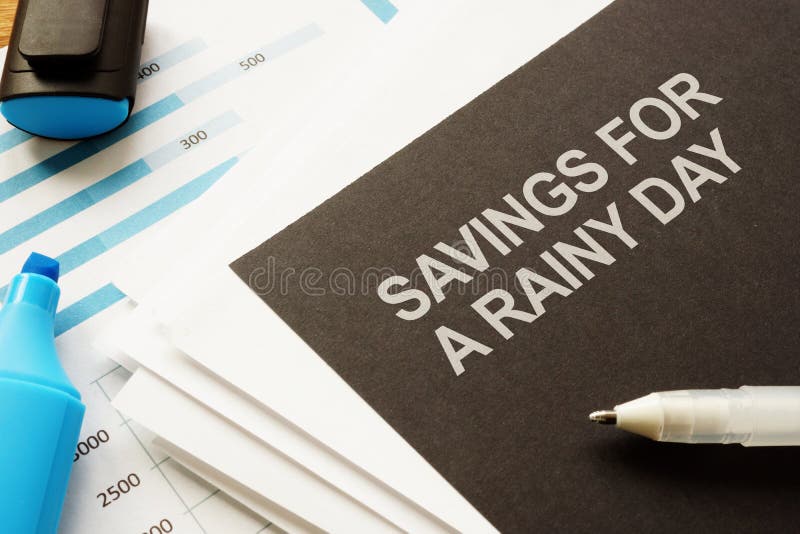 Conceptual hand written text showing savings for a rainy day royalty free stock images
