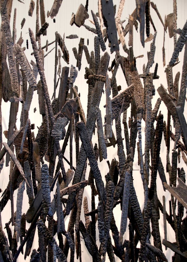 Conceptual image of charred pieces of wood floating in the air stock photo