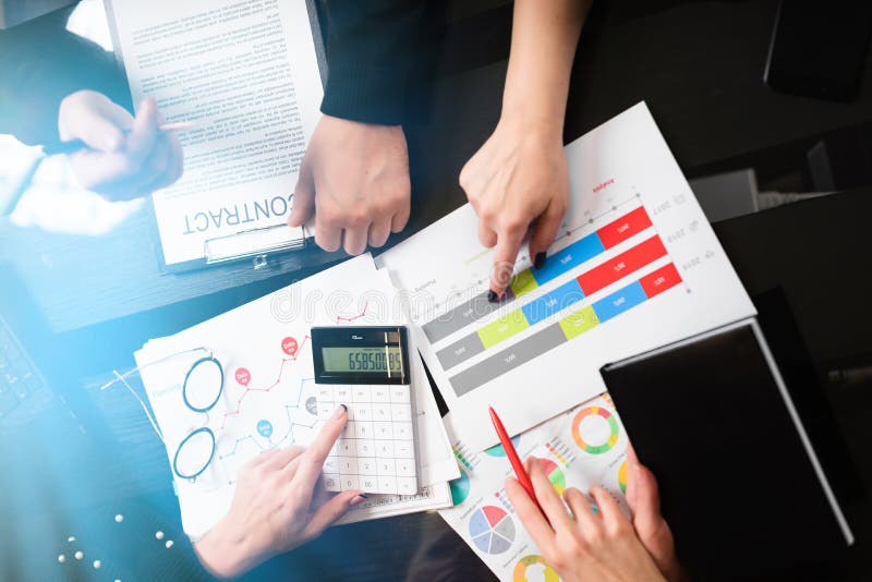 Office Desk with documents and calculator top view stock photos Office Desk with documents and calculator top view stock photos