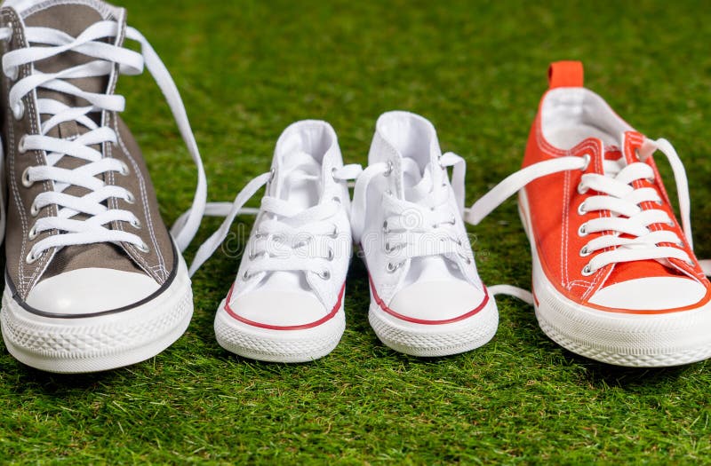 Family Sneakers Canvas Mother Father and Child Shoes on Green Grass in ...