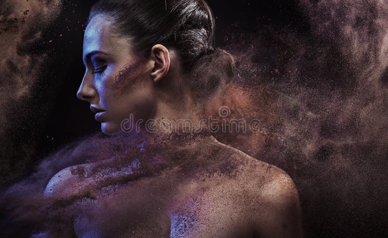 Conceptual portrait of a lady in the middle of a sand storm