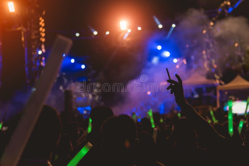 Crowd on Music Show, Happy People with Raised Hands. Orange Stage Light ...
