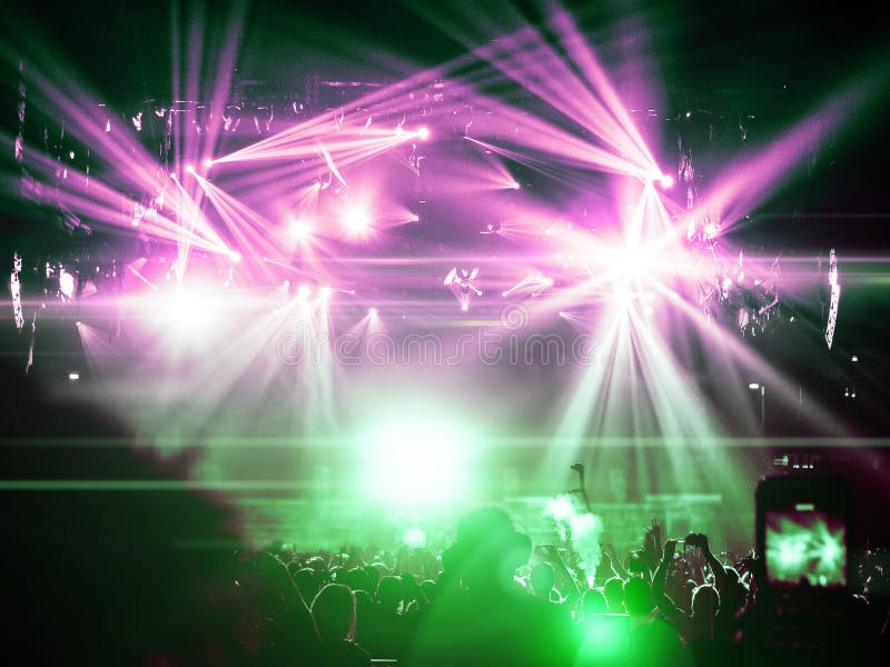 Concert Crowd Silhouettes in Front of a Bright Stage Stock Photo ...