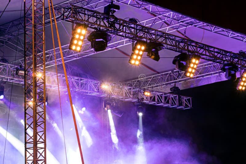 Stage Lights during Outdoor Performance in Smoke with Blue Backlight