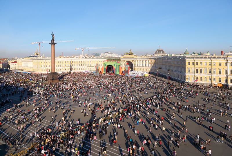 ST. PETERSBURG, RUSSIA - May 9, 2011: Palace Square during the concert on May 9, 2011 in St. Petersburg, Russia. ST. PETERSBURG, RUSSIA - May 9, 2011: Palace Square during the concert on May 9, 2011 in St. Petersburg, Russia.