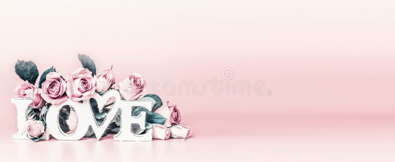 Abstract love concept with word love and pastel pink roses at trendy muted colors background. Creative romantic layout. Wedding card. Copy space. Banner or template. Abstract love concept with word love and pastel pink roses at trendy muted colors background. Creative romantic layout. Wedding card. Copy space. Banner or template