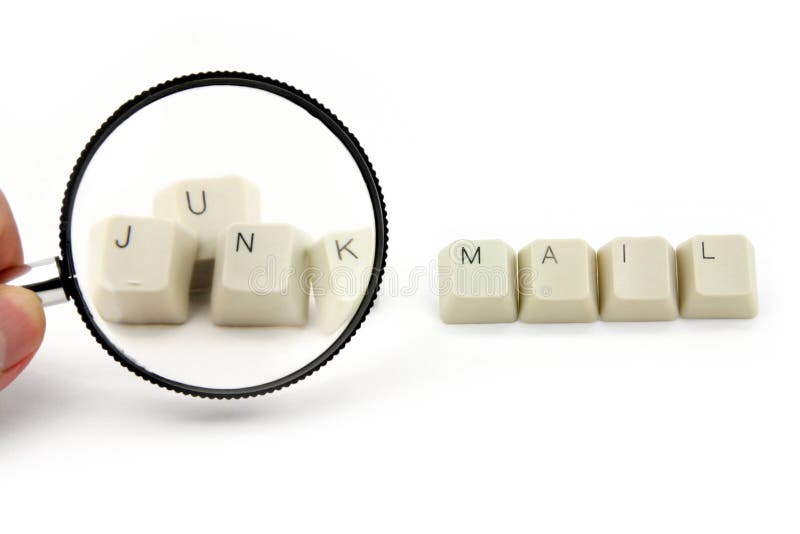 Magnifier and keys, concept of junk mail. Magnifier and keys, concept of junk mail