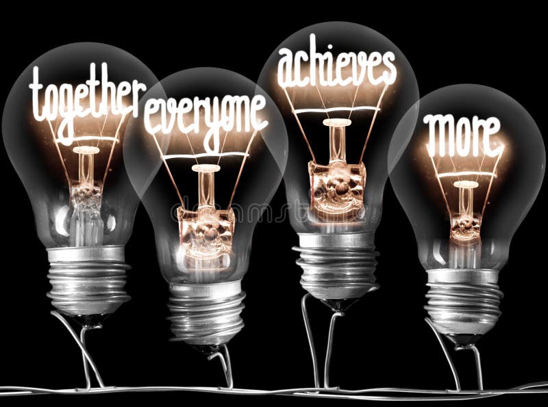 Photo of light bulbs with shining fibers in a shape of TOGETHER, EVERYONE, ACHIEVES, MORE concept words isolated on black background. Photo of light bulbs with shining fibers in a shape of TOGETHER, EVERYONE, ACHIEVES, MORE concept words isolated on black background