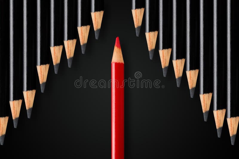 Business concept of disruption, leadership or think different; red pencil dividing row of black pencils in opposite direction; minimal concept flat lay from above on black background. Business concept of disruption, leadership or think different; red pencil dividing row of black pencils in opposite direction; minimal concept flat lay from above on black background