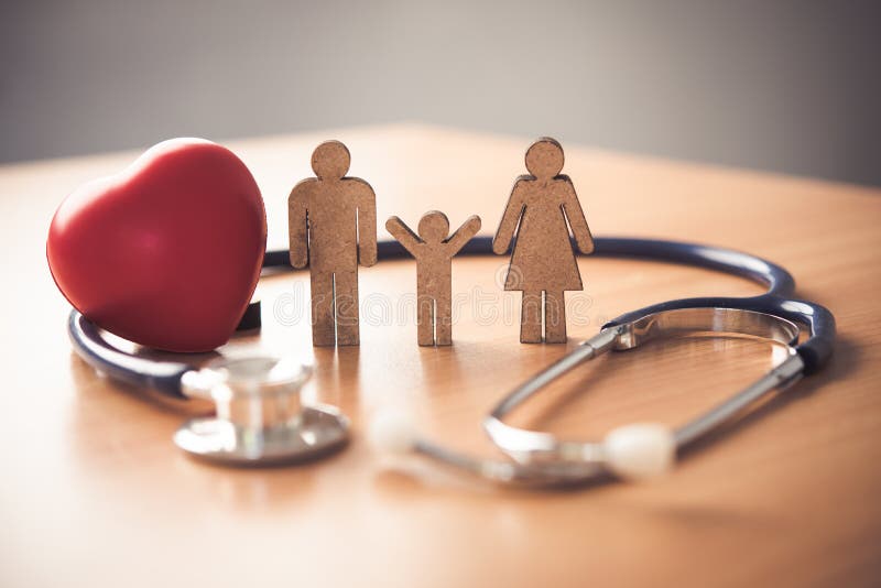 Medical Insurance Concept With Family And Stethoscope On Wooden Desk. Medical Insurance Concept With Family And Stethoscope On Wooden Desk