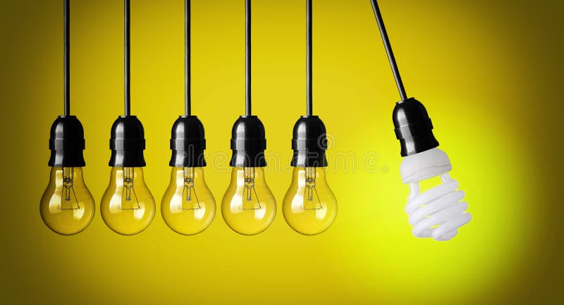 Idea concept on yellow background. Perpetual motion with light bulbs. Idea concept on yellow background. Perpetual motion with light bulbs