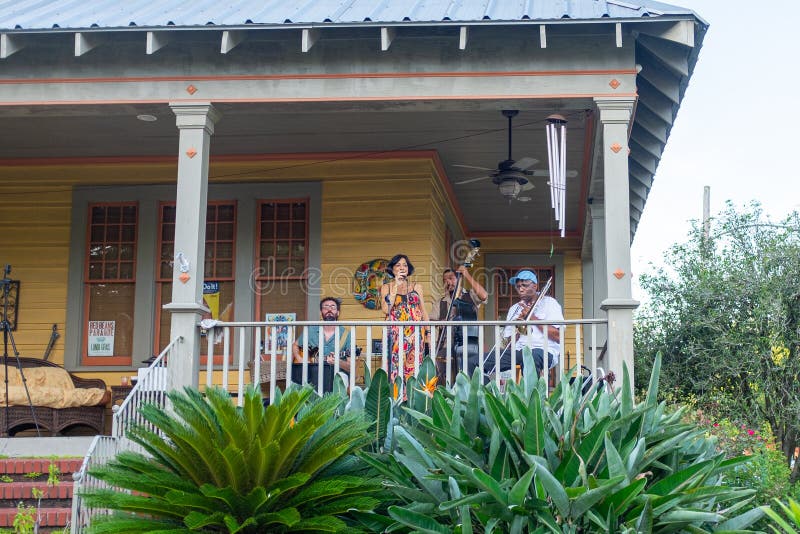 New Orleans, Louisiana/USA - 7/10/2020: Band playing on front porch of house in uptown neighborhood during Corona Virus Pandemic. New Orleans, Louisiana/USA - 7/10/2020: Band playing on front porch of house in uptown neighborhood during Corona Virus Pandemic