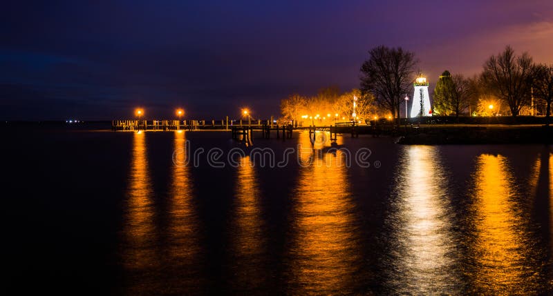 Concord Point Lighthouse and a pier at night in Havre de Grace