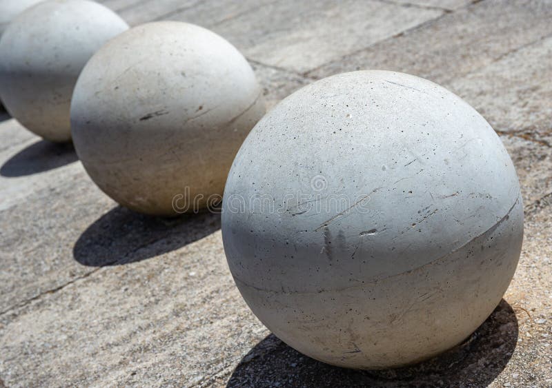 Concrete Balls As a Parking Barriers in the Residential Area Stock