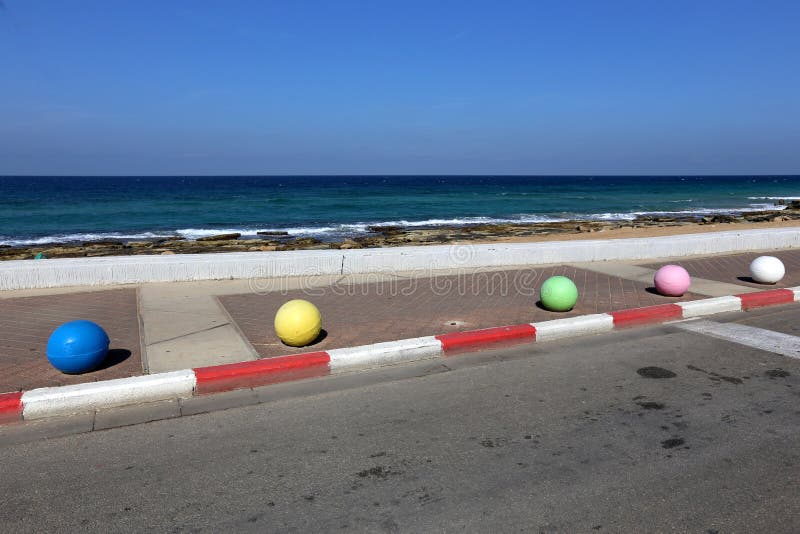 Concrete Balls on the Sidewalk Stock Image - Image of pedestrians