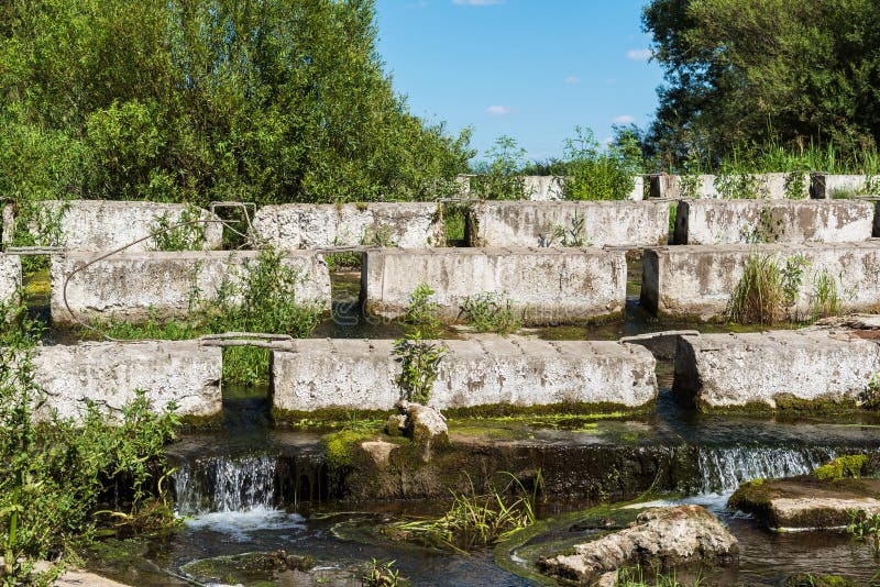 Concrete Blocks Lying on a Small River Dam Stock Photo Image of