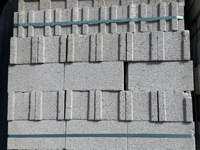 Concrete blocks stacked in a pile creating an industrial construction material background. Mobile photo. Load structural stock images, royalty-free photos and pictures
