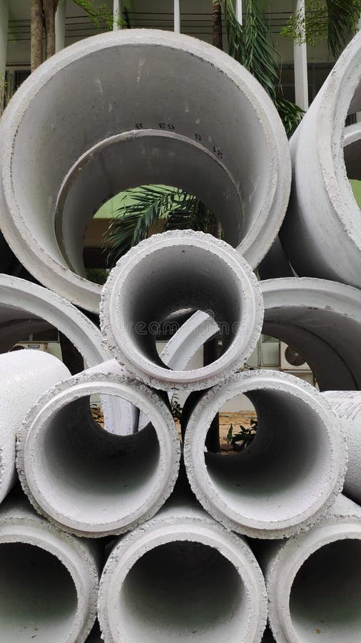 Concrete drainage pipes are stacked for construction. Stock Photo -Concrete drainage pipes are stacked for construction in the construction area stock photos Concrete drainage pipes are stacked for construction. Stock Photo -Concrete drainage pipes are stacked for construction in the construction area stock photos
