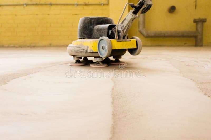 Concrete Floor Grinding. Construction Process. Sanding a Concrete Floor