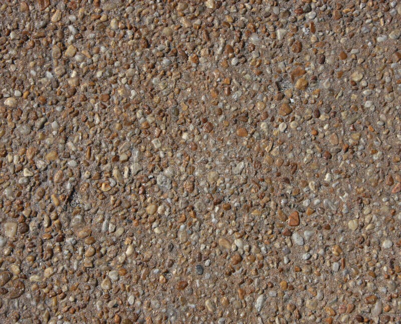 Concrete with gravel texture mottled background royalty free stock photography