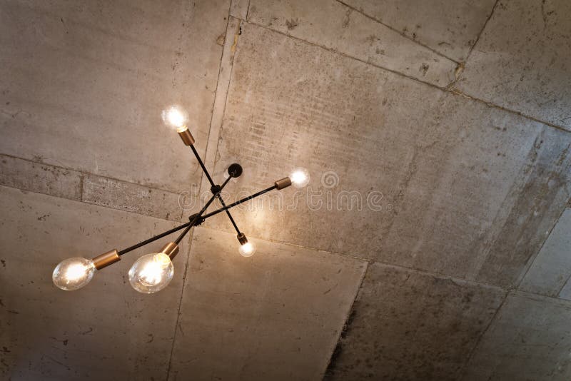 Concrete Ceiling and Lighting in a Modern Apartment. Concrete Style in