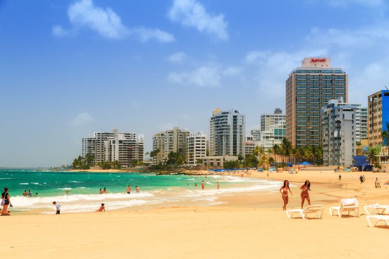 People relaxing at popular touristic Condado beach in San Juan, Puerto Rico, on June 11, 2014. People relaxing at popular touristic Condado beach in San Juan, Puerto Rico, on June 11, 2014