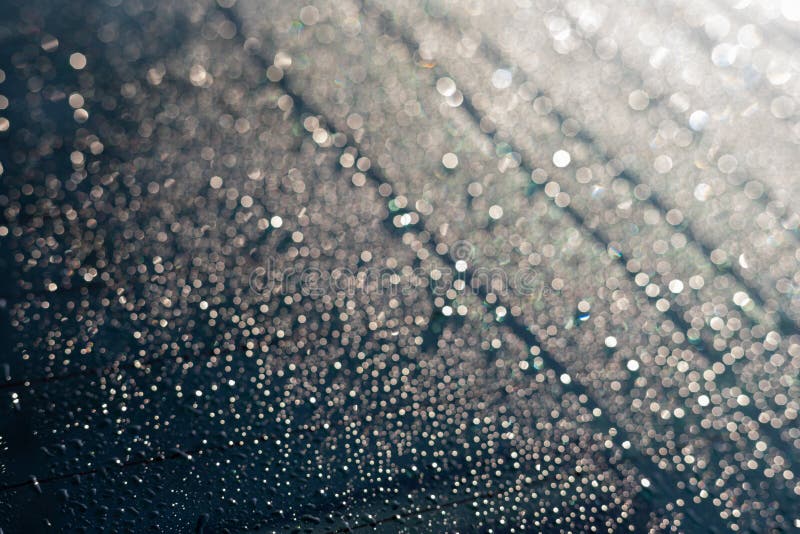 Condensation or Rain Drops on the Car Rear Window in Winter on a Sunny