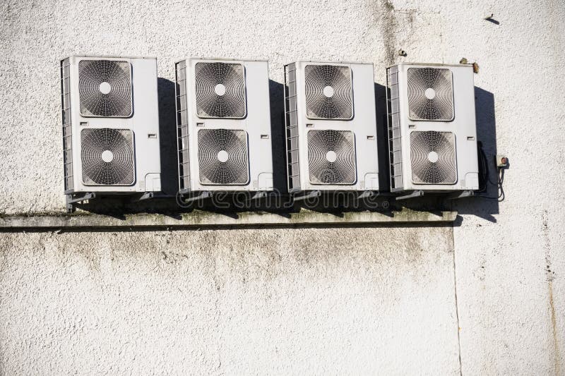Air Conditioning Condensers in Cage Hanging on Wall Stock Photo Image