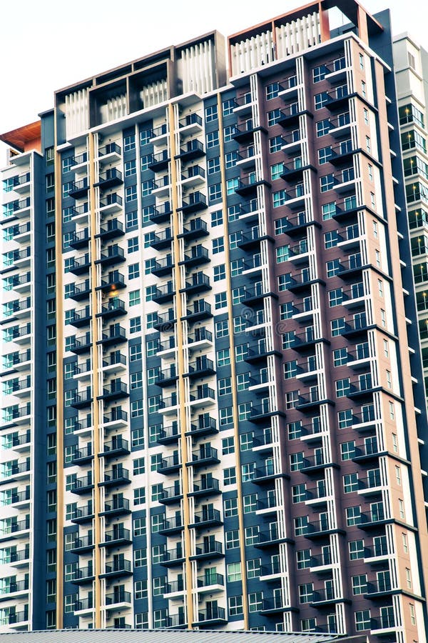 Image of Condo Building and Blue Sky Background. Stock Image Image of