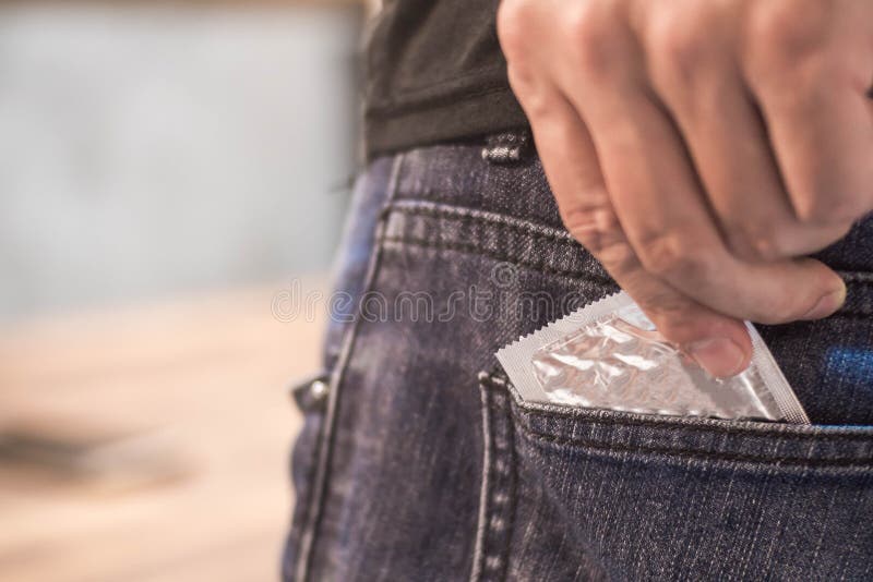 Condom in Jeans pocket stock image. Image of life, healthy 137760209