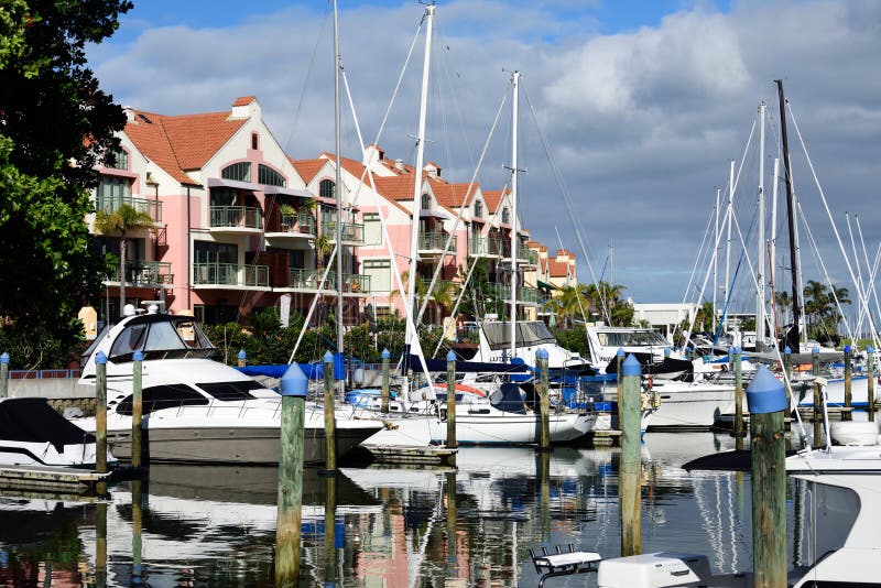 Condos and boats stock image. Image of water, reflection 93979515