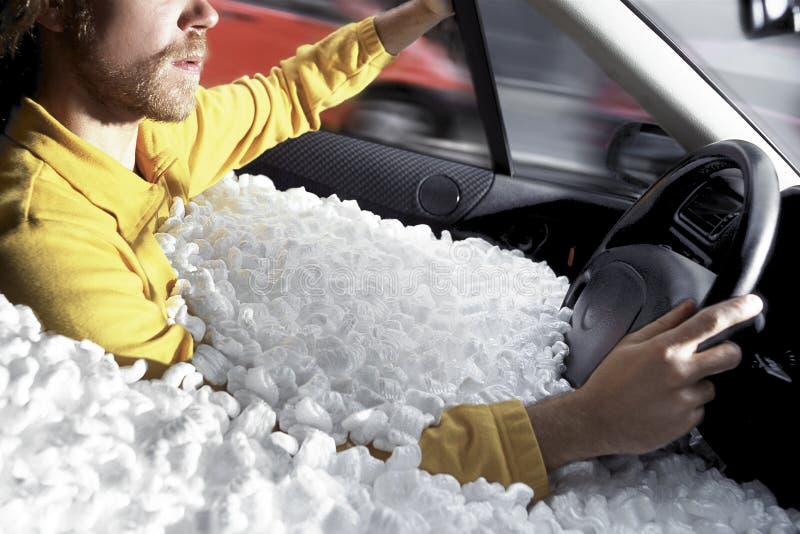 A Man Driving His Car Immersed In Polystyrene: Thiat's Security! :-). A Man Driving His Car Immersed In Polystyrene: Thiat's Security! :-)