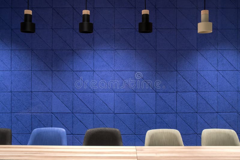 Conference room with blue wall and hanging lamps