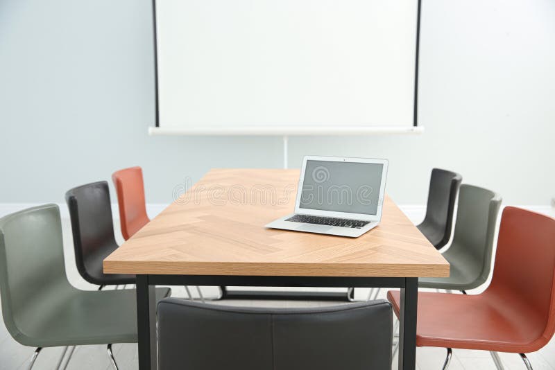 Conference Room Interior with Laptop on Wooden Table Stock Image
